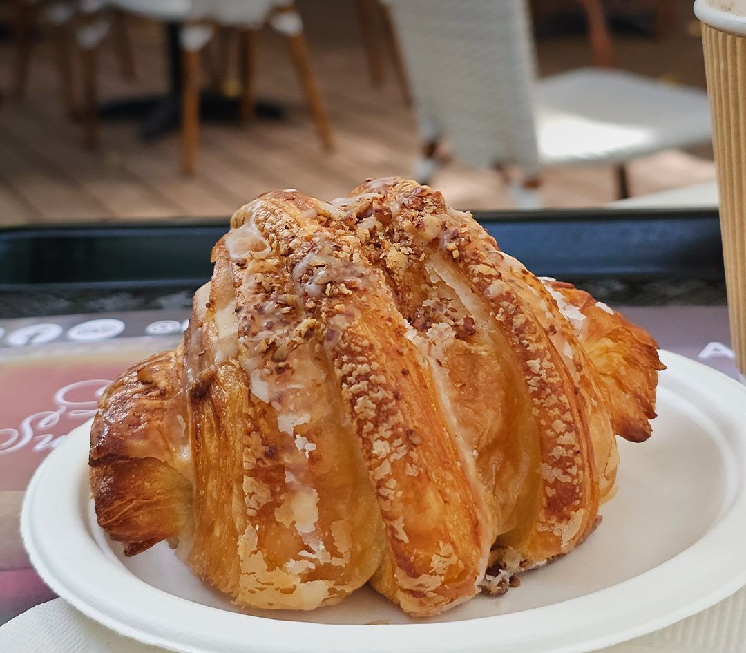 An almond croissant at La Sucrière, one of the classic, chocolate, almond and love croissants baked each morning