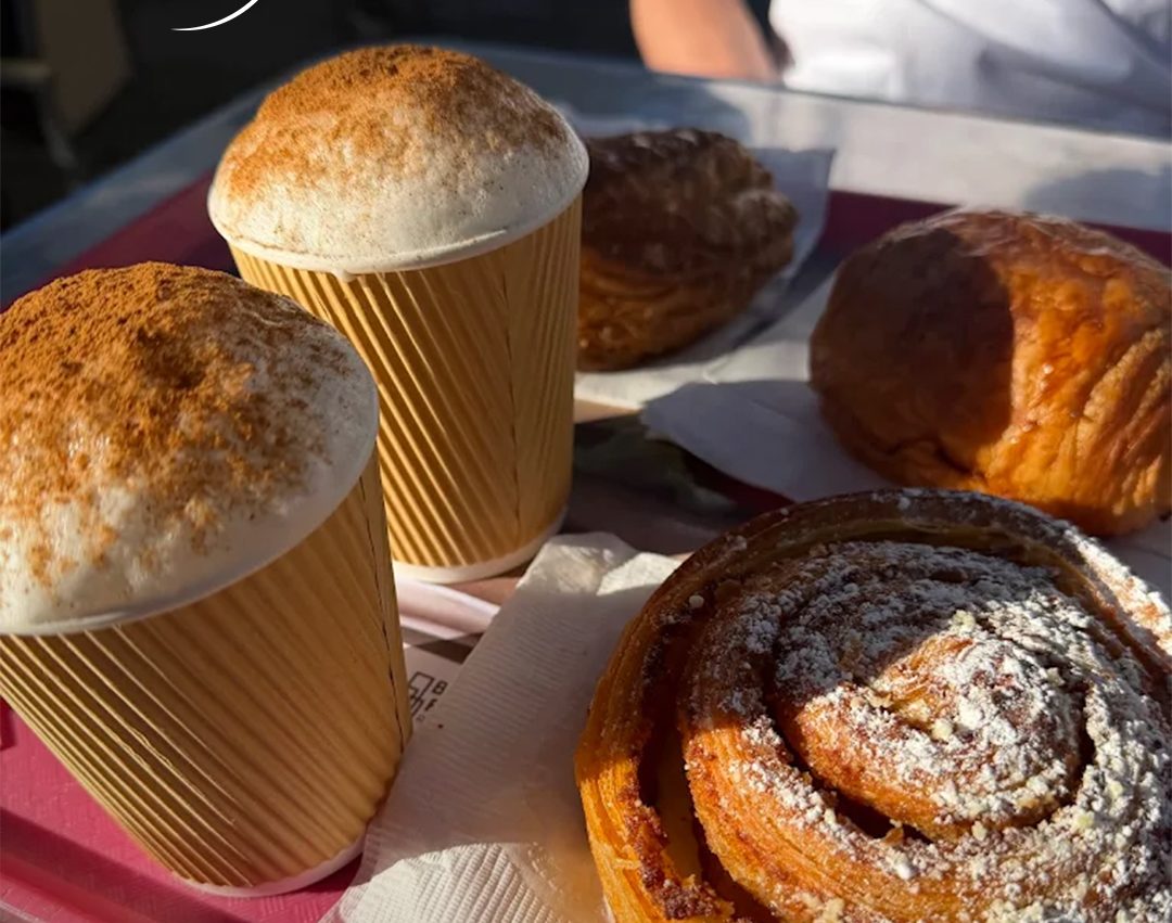 Coffees and pastries on a tray at La Sucrière