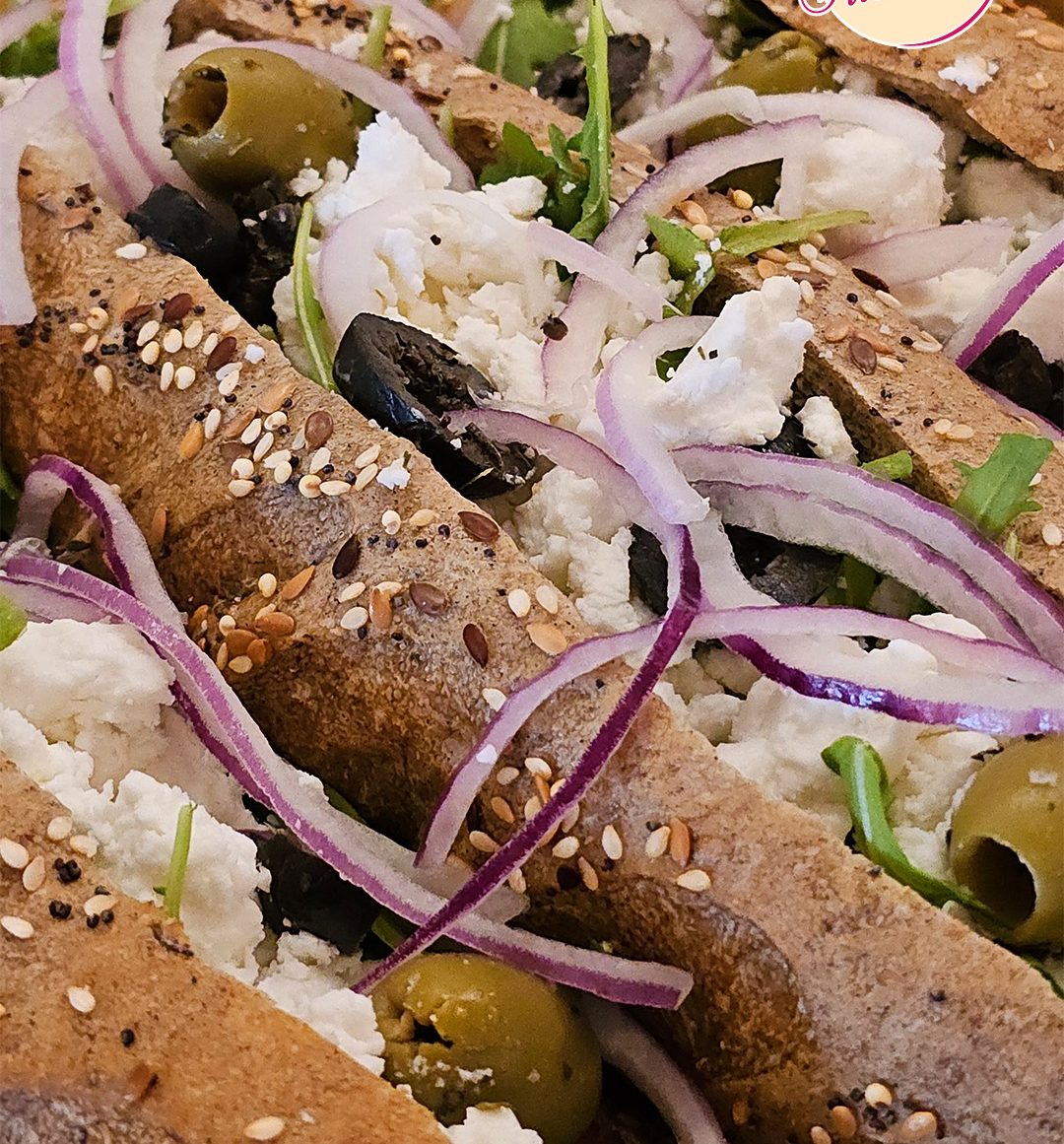 A fresh multigrain sandwich at La Sucrière with feta, olives and red onion