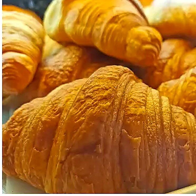 Freshly baked butter croissants at La Sucrière